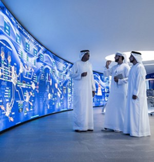 ADNOC employees standing in front of a screen