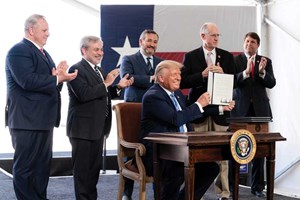 Fig. 4. President Donald J. Trump is applauded as he displays his signature after signing four presidential permits on July 29, 2020, at the Double Eagle drilling site in Midland, Texas. Standing behind the President are (left to right) Secretary of Interior David Bernhardt, Secretary of Energy Dan Brouillette, Senator Ted Cruz, U.S. Rep. Mike Conaway (R-Texas), and U.S. Rep. Jodey Arrington (R-Texas). Official White House Photo by Shealah Craighead.