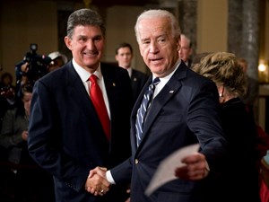 Senator Joe Manchin, left, and President Joe Biden