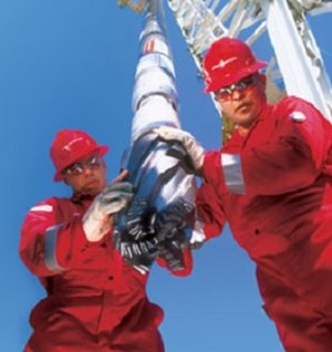 Halliburton workers with drilling equipment