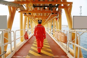 offshore drilling worker in orange suit