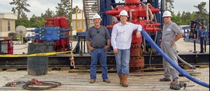 Mark Plummer (center) stands in front of a BOP stack with Chestnut Exploration and Production, Inc., V.P. of field operations, Jack Kodrin (left), and Chestnut Well Service’s V.P. of operations, J. W. Gotreaux (right).