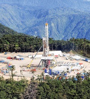 Fig. 3. Within the sluggish South Pacific region, activity in Papua New Guinea is averaging a half-dozen wells annually, including sites like this one in the Hides gas field. Photo: Santos Limited.
