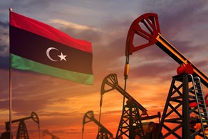 Libyan flag with natural gas drilling rigs
