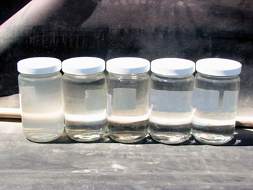 Water samples taken (from left to right) before treatment, after electro-coagulation, after AMS, after RO and after carbon filtration.