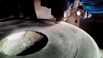 Abrasion testing of a PDC cutter with a vertical turret lathe. Courtesy of US Synthetic.